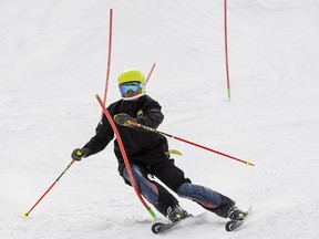 A skier takes in a practice run on a slalom course at the Edmonton Ski Club on Sunday, March 13, 2022 in Edmonton.