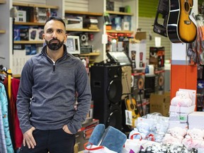 Shady Darwish pictured in his store City Liquidation on March 26, 2022. Four businesses have seen their revenue almost 100% disappear due to street frontage and signage completely blocked off by fencing and scrim along 118 ave. Jason Franson for Postmedia