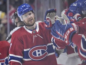 Mar 19, 2022; Montreal, Quebec, CAN; Montreal Canadiens defenseman Brett Kulak (77) celebrates with teammates after scoring a goal against the Ottawa Senators during the third period at the Bell Centre. Mandatory Credit: Eric Bolte-USA TODAY Sports