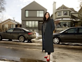 Mariah Samji, executive director of the Infill Development in Edmonton Association, poses for a photo in front of a recent Edmonton infill home (centre left), on Tuesday March 15, 2022. Photo by David Bloom