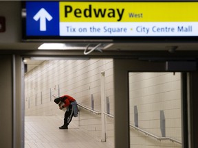 A woman under the influence of “down” (fentanyl or carfentanil) in Edmonton’s underground pedway system, on Friday Feb. 25, 2022.