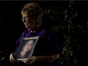 Faye Gray holds a photo of her daughter, Lindsey Gray, in St. Albert on Wednesday, Jan. 12, 2022. Lindsey died of an overdose in 2015.
