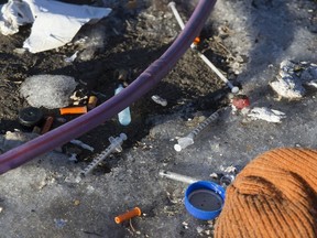 Discarded needles and drug paraphernalia is visible in downtown Edmonton Friday Feb. 11, 2022.