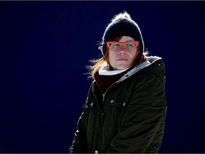Angie Staines, co-founder of Boots On Ground, poses for a photo in downtown Edmonton on Tuesday. Boots on Ground is a harm reduction organization that hands out naloxone kits, safe supplies and provides education on safe use.
