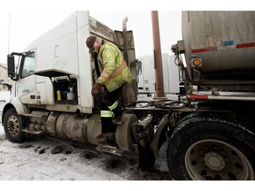 Truck driver Bart Sagmoen climbs down from his rig while stopped at the Roadking truck stop in Sherwood Park on Wednesday Feb. 16, 2022.