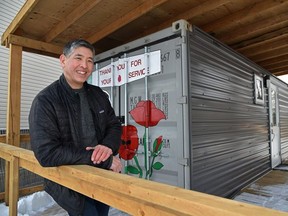 Yasushi Ohki, executive director of the Green Violin Community Development Company, outside one of their demo cabins in Edmonton, March 8, 2022.