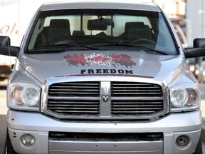 A stylized Canadian Flag and the word Freedom are visible on a pickup truck parked at a gas station in downtown Edmonton, Thursday March 31, 2022. On April 1, 2022 the federal carbon tax takes effect. It also marks the beginning of a pause on collecting a 13-cent-per-litre Alberta gas tax.