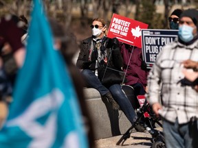 Demonstrators protest during the Rally to Support Public Healthcare organized by Protect our Province Alberta at the Alberta Legislature in Edmonton, on Wednesday, April 6, 2022.