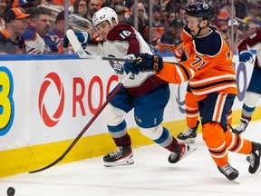 Edmonton Oilers’ Ryan McLeod (71) battles Colorado Avalanche’s Nicolas Aube-Kubel (16) during third period NHL action at Rogers Place in Edmonton, on Saturday, April 9, 2022.