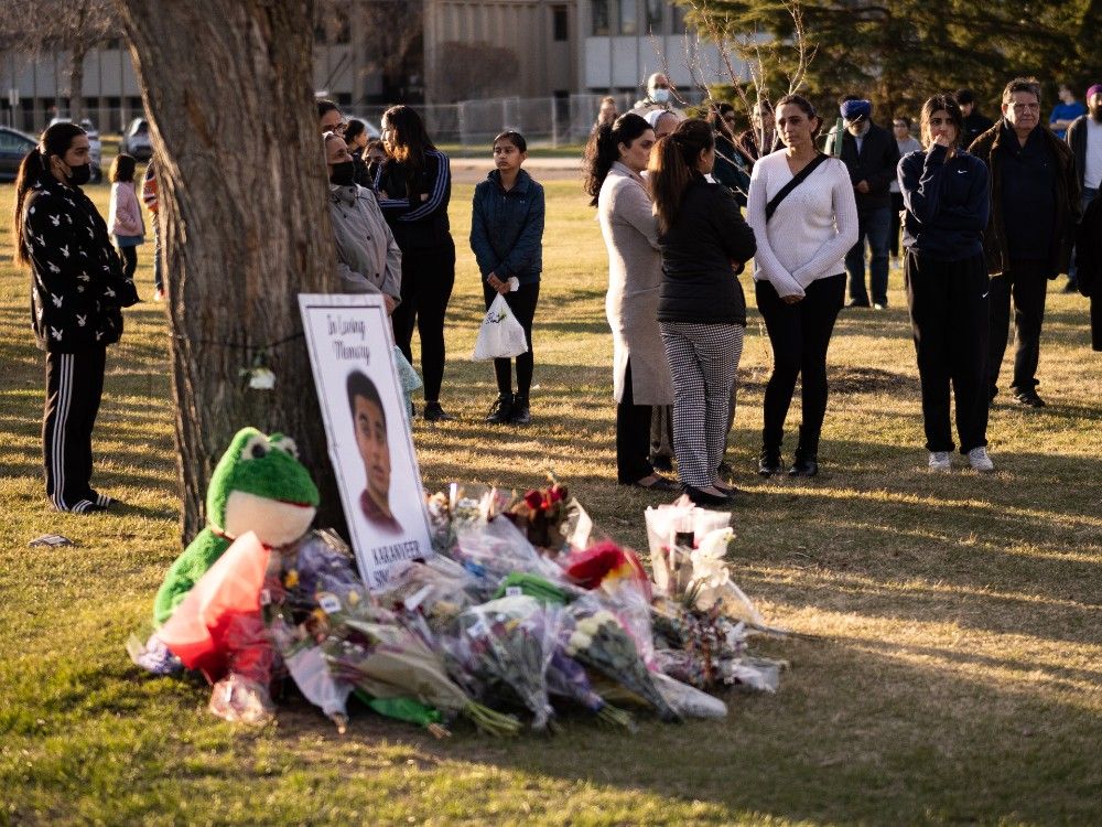 Hundreds gather for candlelight vigil at McNally High School for