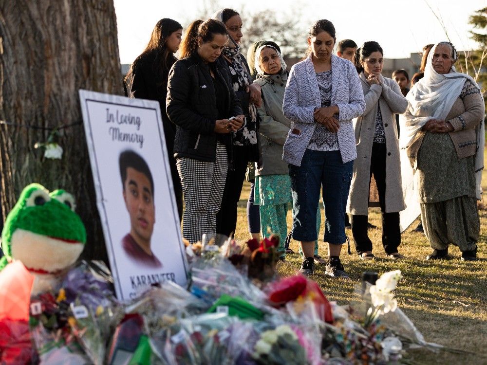 Hundreds gather for candlelight vigil at McNally High School for