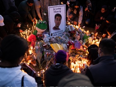 Family and friends lit candles in memory of Karanveer Sahota, who was beaten and stabbed to death outside McNally High School, during a vigil outside his school in Edmonton, on Friday, April 29, 2022.