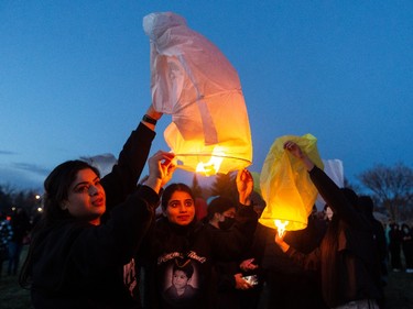 Family and friends released lanterns for Karanveer Sahota, who was beaten and stabbed to death outside McNally High School, during a vigil outside his school in Edmonton, on Friday, April 29, 2022.
