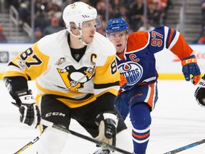 Connor McDavid (97) of the Edmonton Oilers pursues Sidney Crosby (87) of the Pittsburgh Penguins on March 10, 2017, at Rogers Place in Edmonton.