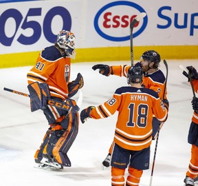 Edmonton Oilers goalie Mike Smith (41) celebrates his shutout with teammates after defeating the Vegas Golden Knights 4-0 on Saturday, April 16, 2022, in Edmonton.
