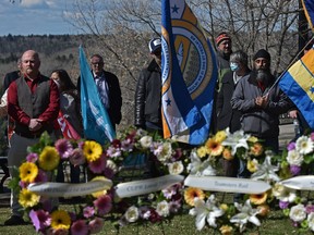 Attendees gathered for a National Day of Mourning ceremony at Grant Notley Park at 116 Street and 100 Avenue honouring workplace-related deaths in Edmonton on Thursday, April 28, 2022.