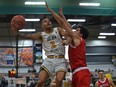 University of Alberta Golden Bears guard Tyus Jefferson (3) goes up for the shot against McGill Redbirds guard Cameron Elliot (5) during the 2022 U Sports Final Eight tournament at the Saville Community Sports Centre in Edmonton on April 1, 2022.