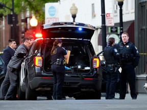 Police are seen after an early-morning shooting in a stretch of the downtown near the Golden 1 Center arena in Sacramento, California, U.S. April 3, 2022.