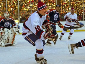 Hockey icon Guy Lafleur chases the puck at the Heritage Classic hockey game held outdoors at Commonwealth Stadium in Edmonton on November 22, 2003. The former Montreal Canadien has died at the age of 70.