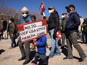 Demonstrators protest during the Rally to Support Public Healthcare organized by Protect our Province Alberta at the Alberta legislature in Edmonton on Wednesday, April 6, 2022.