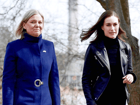 Swedish Prime Minister Magdalena Andersson, left, and Finnish Prime Minister Sanna Marin walk together prior to a meeting on whether to seek NATO membership in Stockholm, Sweden, on April 13, 2022.