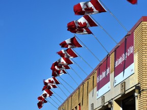 Canadian flag flapping in the wind outside a storage complex as gusts of 40 km/h were being forecasted in Edmonton, April 6, 2022.