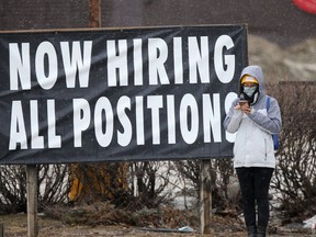 A sign advertising hiring in all positions is seen in Winnipeg. The unemployment rate in Canada hasn't been this low since 1976.