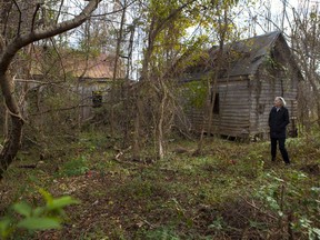 Archaeologist Julia King tours an abandoned house built on the ancestral land in Virginia.