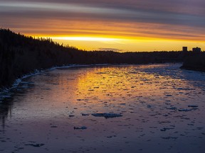 Ice flows down the North Saskatchewan river as the sun sets on Tuesday,April  5, 2022 in Edmonton.