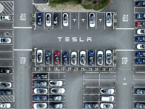 Tesla cars sit parked in a lot at the company's factory in Fremont, California.