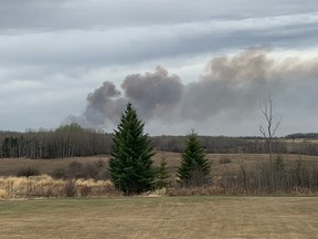 A wildfire burns in Parkland County, near the village of Tomahawk, on May 7, 2021.