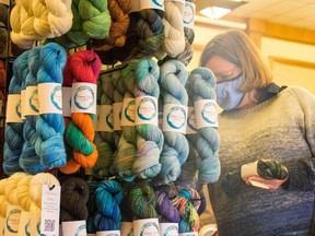 Attendees of the fall 2021 Fibre Frolic in Edmonton browse through a vibrant array of wool.