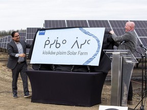 Stuart Lee,(right) President & CEO, EPCOR and

Chief Billy Morin, (left) Enoch Cree Nation unveil a new sign as EPCOR and Enoch Cree Nation continue to advance their relationship in the spirit

of reconciliation and collaboration, the solar farm in west Edmonton is being given an

Indigenous name, kisikaw pisim on Wednesday, May 4, 2022  in Edmonton.