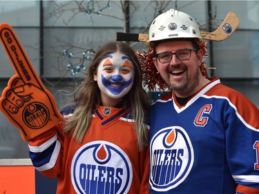 Gord McQueen with his daughter Brooklyn, 13, decked out in Oilers attire joining fans at the tailgate party in the ICE district Plaza prior to the start of the Oilers game two against the LA Kings in Edmonton, May 4, 2022.