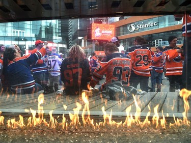 A gas flame burns as fans attend the tailgate party in the ICE district Plaza prior to the start of the Oilers game two against the LA Kings in Edmonton, May 4, 2022.