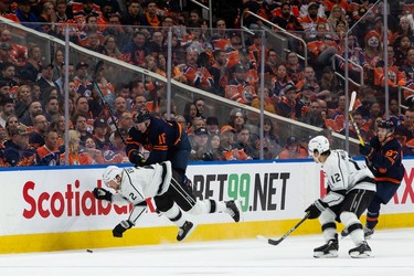 Edmonton Oilers' Zach Hyman (18) hits L.A. Kings' Alexander Edler (2) during first period NHL action in Game 2 of their first round Stanley Cup playoff series in Edmonton, on Wednesday, May 4, 2022.