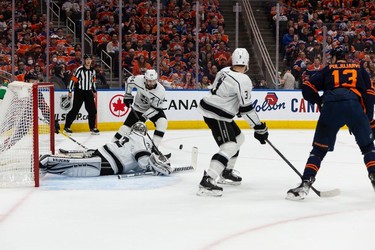 Edmonton Oilers' Jesse Puljujarvi (13) watches L.A. Kings' goaltender Jonathan Quick (32) making a save during first period NHL action in Game 2 of their first round Stanley Cup playoff series in Edmonton, on Wednesday, May 4, 2022.