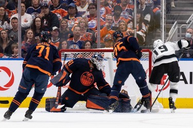 Edmonton Oilers' goaltender Mike Smith (41) makes a save on L.A. Kings' Alex Iafallo (19) during first period NHL action in Game 2 of their first round Stanley Cup playoff series in Edmonton, on Wednesday, May 4, 2022.