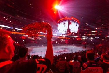 Edmonton Oilers fans stand for the national anthem before the team plays the L.A. Kings during Game 2 of their first round Stanley Cup NHL playoff series in Edmonton, on Wednesday, May 4, 2022.