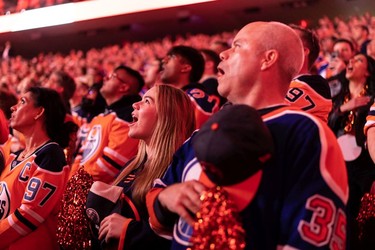 Edmonton Oilers fans sing the national anthem before the team plays the L.A. Kings during Game 2 of their first round Stanley Cup NHL playoff series in Edmonton, on Wednesday, May 4, 2022.