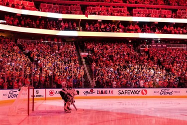 Edmonton Oilers fans sing the national anthem before the team plays the L.A. Kings during Game 2 of their first round Stanley Cup NHL playoff series in Edmonton, on Wednesday, May 4, 2022.