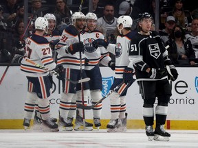 LOS ANGELES, CALIFORNIA - MAY 12: Evander Kane #91 of the Edmonton Oilers celebrates his goal with Connor McDavid #97, Zach Hyman #18 and Brett Kulak #27, behind Troy Stecher #51 of the Los Angeles Kings, to take a 2-0 lead, during the second period in Game Six of the First Round of the 2022 Stanley Cup Playoffs at Crypto.com Arena on May 12, 2022 in Los Angeles, California.