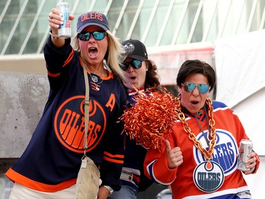 Edmonton Oilers fans pose for a photo at Rogers Place as they wait for the start of Game 5 between the Oilers and Los Angeles Kings, in Edmonton Tuesday May 10, 2022.