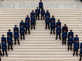 Edmonton Police Service Recruit Training Class No. 153 officers are seen during their graduation ceremony at Edmonton city hall on May 13, 2022. A third-party investigator is currently probing "workplace harassment" allegations in the service's training unit.