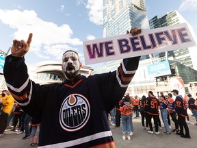 Oilers fan David Thomas cheers during the Ford Tailgate Party outside of Rogers Place before watching Game 7 of the NHL Stanley Cup playoffs series between the Edmonton Oilers and the L.A. Kings in Edmonton, on Saturday, Nov. 14, 2022. He wore his favourite Fernando Pisani jersey signed by Oilers greats like Grant Fuhr for good luck.