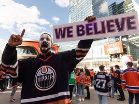 Oilers fan David Thomas cheers during the Ford Tailgate Party outside of Rogers Place before watching Game 7 of the NHL Stanley Cup playoffs series between the Edmonton Oilers and the L.A. Kings in Edmonton, on Saturday, Nov. 14, 2022. He wore his favourite Fernando Pisani jersey signed by Oilers greats like Grant Fuhr for good luck.