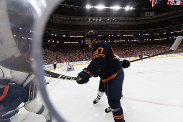 Edmonton Oilers' Connor McDavid (97) battles L.A. Kings' Blake Lizotte (46) during first period NHL Stanley Cup playoffs action at Rogers Place in Edmonton, on Saturday, May 14, 2022.