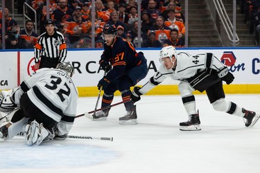 Edmonton Oilers' Connor McDavid (97) is stopped by L.A. Kings' goaltender Jonathan Quick (32) during first period NHL Stanley Cup playoffs action at Rogers Place in Edmonton, on Saturday, May 14, 2022.