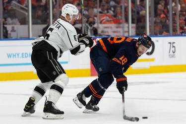 Edmonton Oilers' Zach Hyman (18) battles L.A. Kings' Olli Maatta (6) during first period NHL Stanley Cup playoffs action at Rogers Place in Edmonton, on Saturday, May 14, 2022. Photo by Ian Kucerak