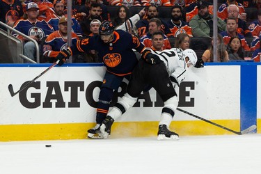 Edmonton Oilers' Evander Kane (91) battles L.A. Kings' Alexander Edler (2) during first period NHL Stanley Cup playoffs action at Rogers Place in Edmonton, on Saturday, May 14, 2022.